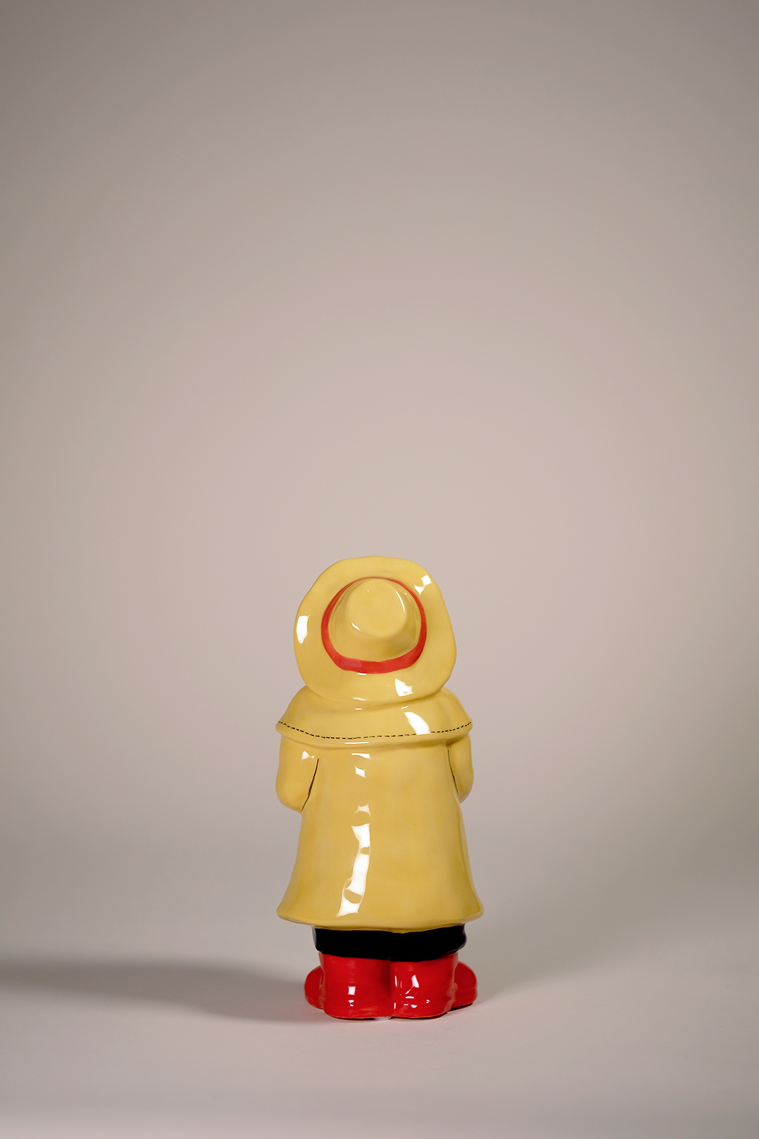 Man Holds the Sailboat Figurine