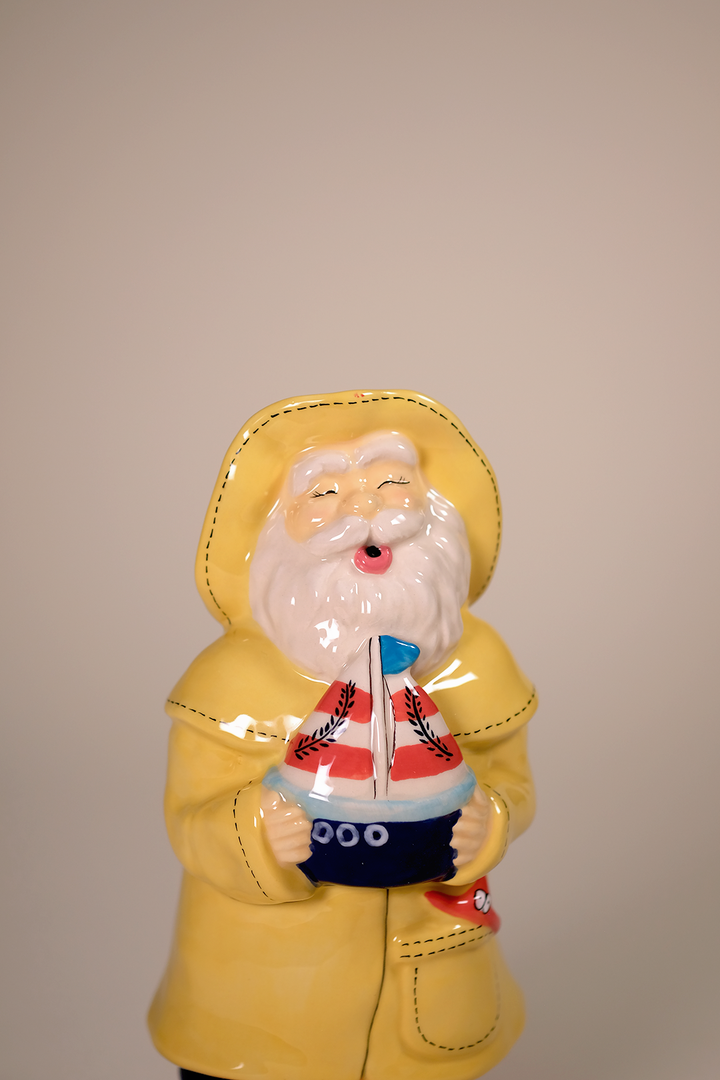 Man Holds the Sailboat Figurine