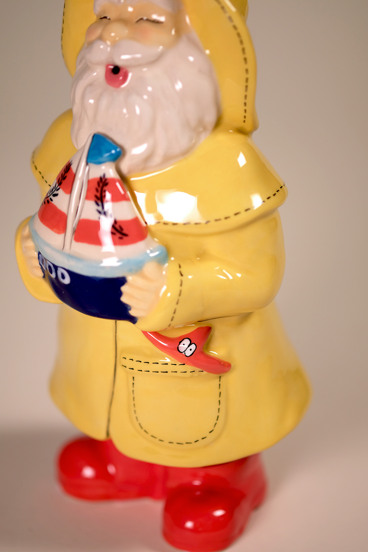 Man Holds the Sailboat Figurine