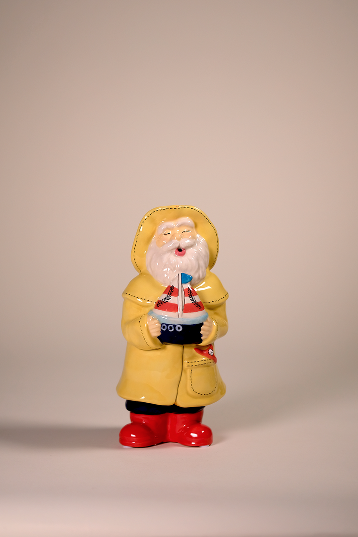 Man Holds the Sailboat Figurine